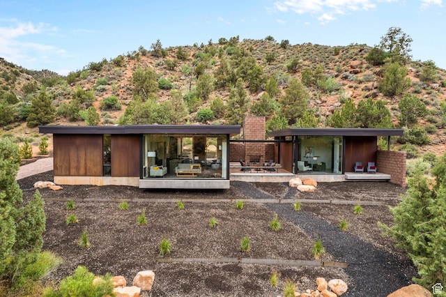 112 Canyon Cv, Springdale, UT 84767 - rear view of house with a chimney