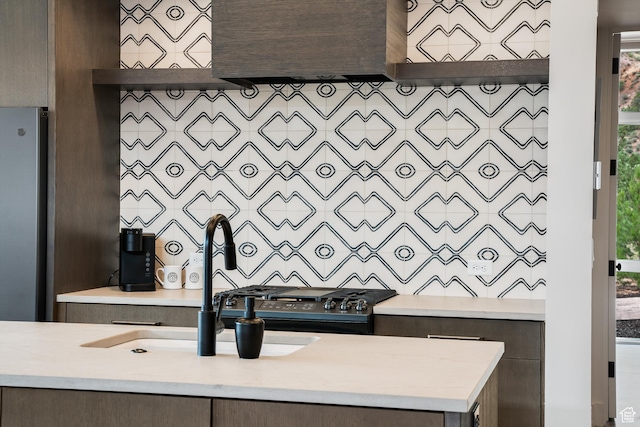 112 Canyon Cv, Springdale, UT 84767 - interior space with a sink, custom exhaust hood, dark brown cabinetry, light countertops, and freestanding refrigerator
