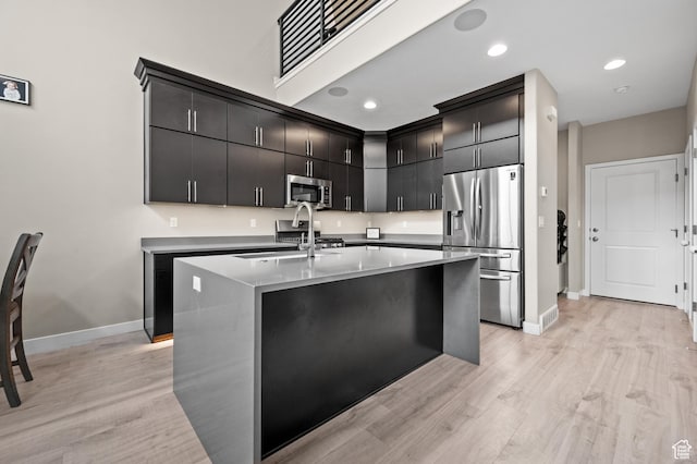 15084 S Wild Horse Way, Bluffdale, UT 84065 - kitchen featuring a sink, light wood-style floors, stainless steel appliances, and baseboards