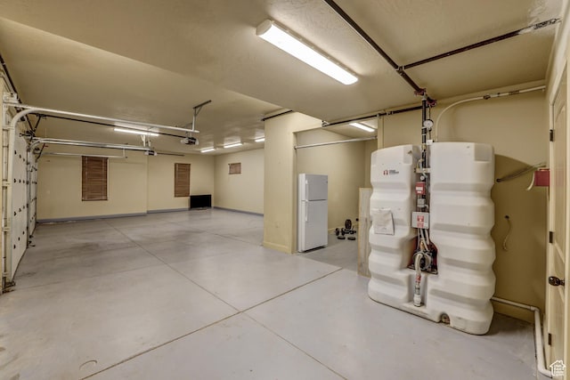 595 W 2050 S, Hurricane, UT 84737 - garage with baseboards and freestanding refrigerator