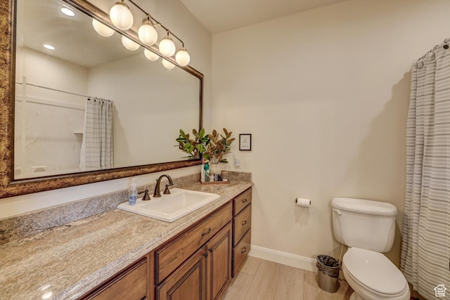 595 W 2050 S, Hurricane, UT 84737 - full bathroom with vanity, curtained shower, toilet, baseboards, and wood finished floors