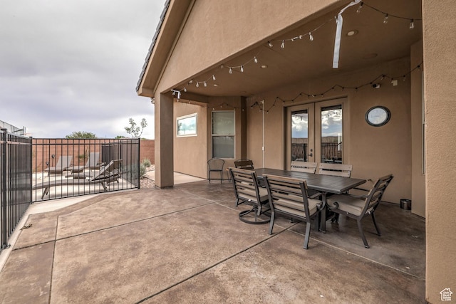 595 W 2050 S, Hurricane, UT 84737 - view of patio featuring fence, outdoor dining space, and french doors