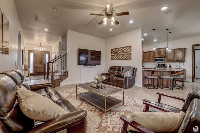 595 W 2050 S, Hurricane, UT 84737 - living area with recessed lighting, stairs, baseboards, arched walkways, and ceiling fan with notable chandelier