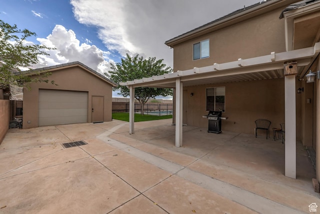595 W 2050 S, Hurricane, UT 84737 - view of patio / terrace featuring fence, area for grilling, a detached garage, and an outbuilding