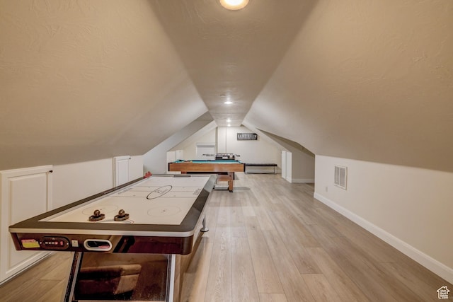 595 W 2050 S, Hurricane, UT 84737 - recreation room featuring baseboards, visible vents, light wood-style floors, and lofted ceiling