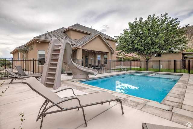 595 W 2050 S, Hurricane, UT 84737 - view of swimming pool with fence, a water slide, a patio, and a fenced in pool