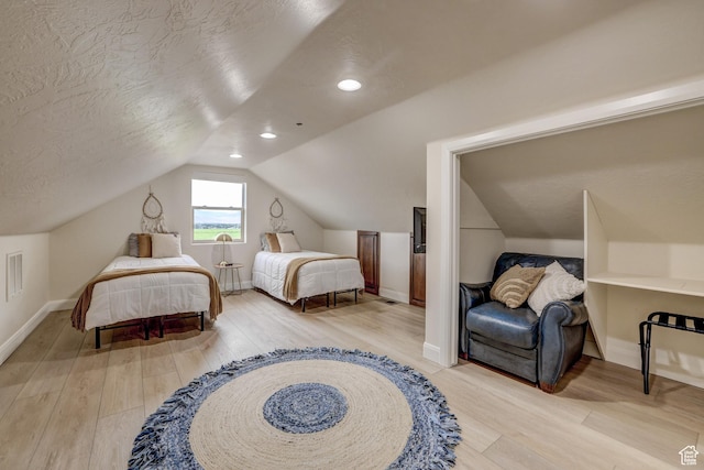 595 W 2050 S, Hurricane, UT 84737 - bedroom featuring lofted ceiling, a textured ceiling, wood finished floors, and baseboards