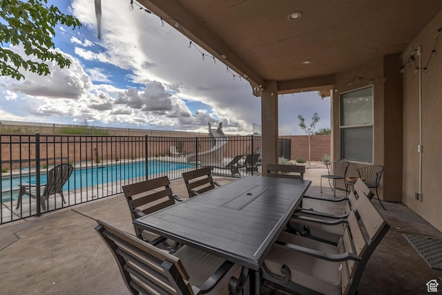 595 W 2050 S, Hurricane, UT 84737 - view of patio featuring outdoor dining area, a fenced in pool, and a fenced backyard