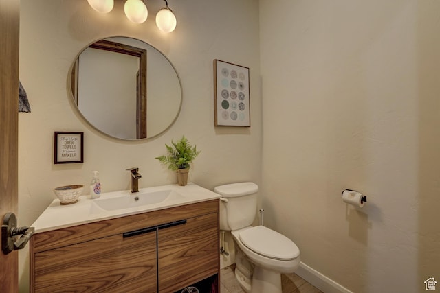 595 W 2050 S, Hurricane, UT 84737 - half bathroom featuring vanity, toilet, and baseboards