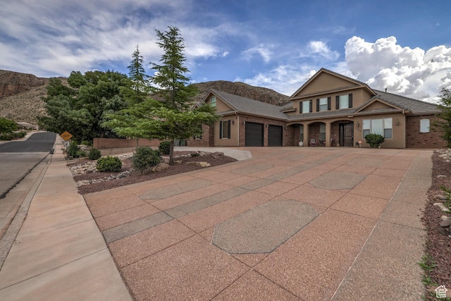 595 W 2050 S, Hurricane, UT 84737 - craftsman-style home with a mountain view, driveway, a garage, and stucco siding