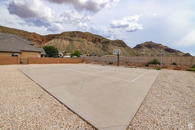 595 W 2050 S, Hurricane, UT 84737 - view of sport court featuring a mountain view, fence, and community basketball court