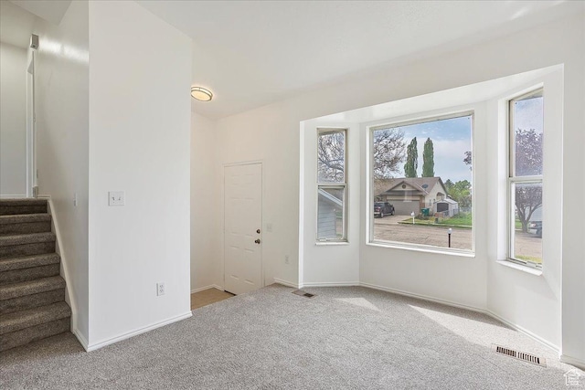 42 W 1980 S, Clearfield, UT 84015 - unfurnished room featuring visible vents, carpet floors, and plenty of natural light