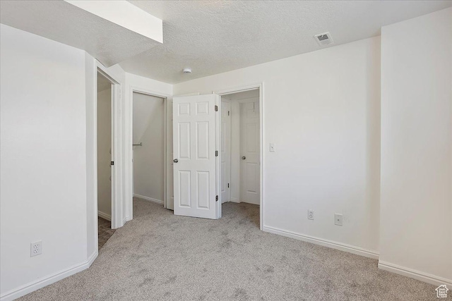 42 W 1980 S, Clearfield, UT 84015 - unfurnished bedroom with a textured ceiling, carpet flooring, baseboards, and visible vents