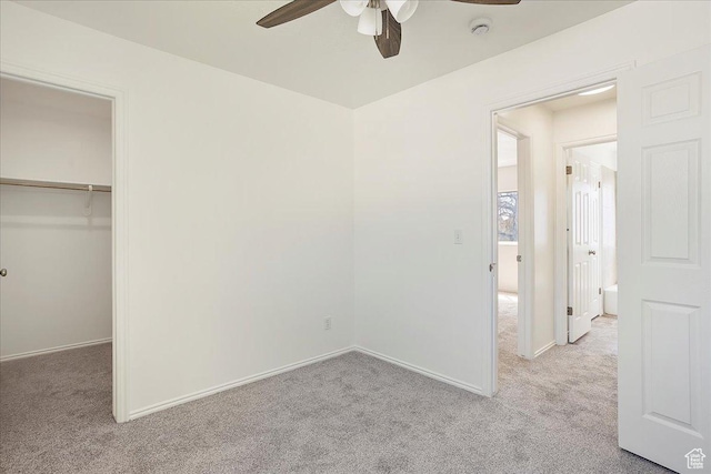 42 W 1980 S, Clearfield, UT 84015 - unfurnished bedroom with baseboards, a spacious closet, a ceiling fan, and light carpet