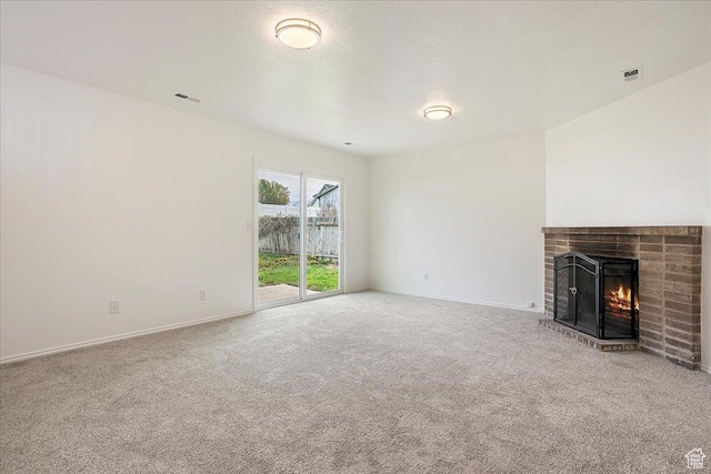 42 W 1980 S, Clearfield, UT 84015 - unfurnished living room featuring baseboards, visible vents, a fireplace, and carpet flooring