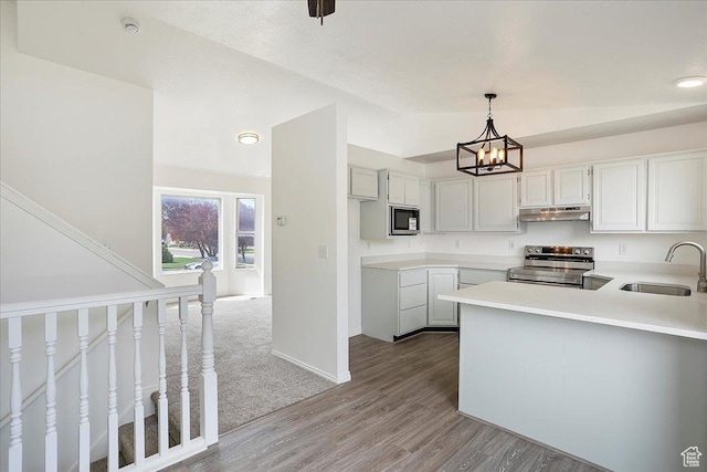 42 W 1980 S, Clearfield, UT 84015 - kitchen featuring stainless steel electric range oven, an inviting chandelier, wood finished floors, under cabinet range hood, and a sink