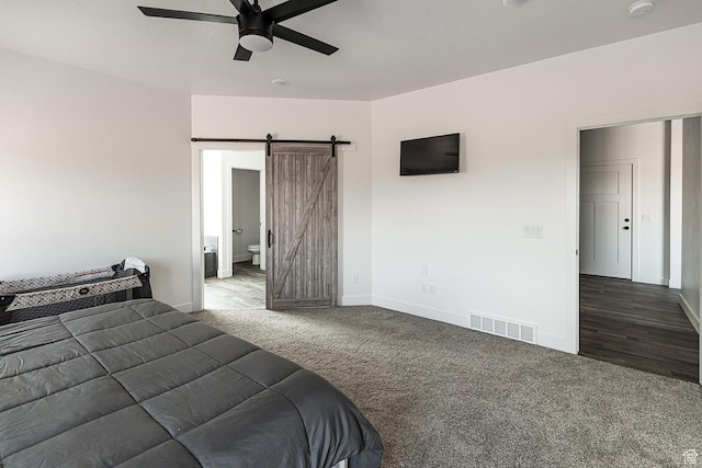 166 W 580 N, Redmond, UT 84652 - carpeted bedroom with a barn door, baseboards, ensuite bath, ceiling fan, and visible vents
