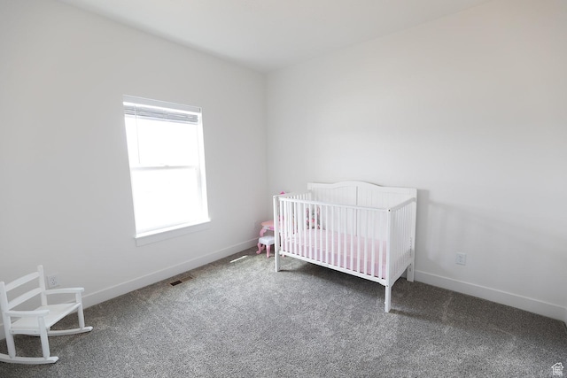 166 W 580 N, Redmond, UT 84652 - carpeted bedroom featuring a nursery area, visible vents, and baseboards