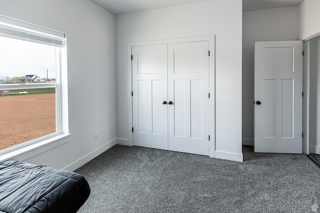 166 W 580 N, Redmond, UT 84652 - bedroom featuring baseboards, a closet, and dark carpet