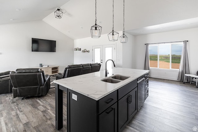 166 W 580 N, Redmond, UT 84652 - kitchen with dark cabinets, a sink, open floor plan, dishwasher, and light wood-style floors