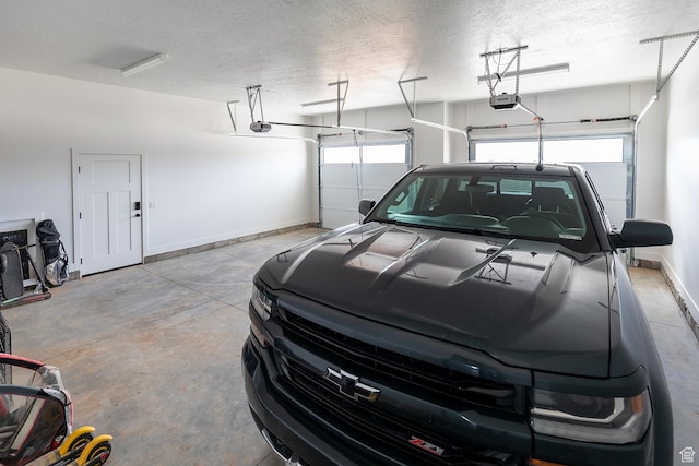 166 W 580 N, Redmond, UT 84652 - garage with baseboards and a garage door opener