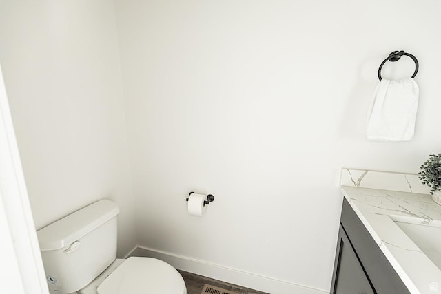 166 W 580 N, Redmond, UT 84652 - half bath featuring toilet, baseboards, vanity, and wood finished floors