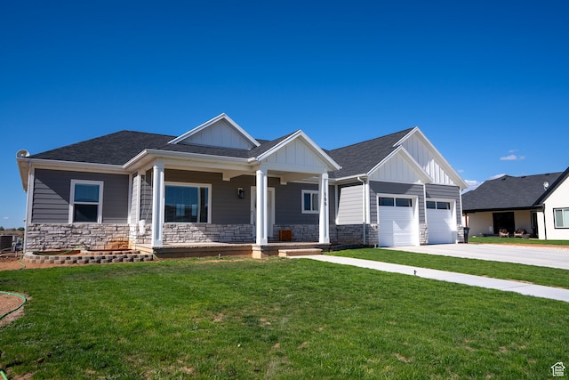 166 W 580 N, Redmond, UT 84652 - craftsman inspired home with stone siding, concrete driveway, board and batten siding, a front lawn, and a porch