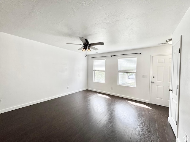 1614 W Eisenhower Way, Salt Lake City, UT 84104 - spare room with a textured ceiling, ceiling fan, dark wood-style floors, and baseboards