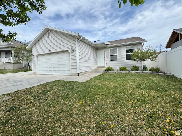 ranch-style house with a garage, fence, a front lawn, and driveway