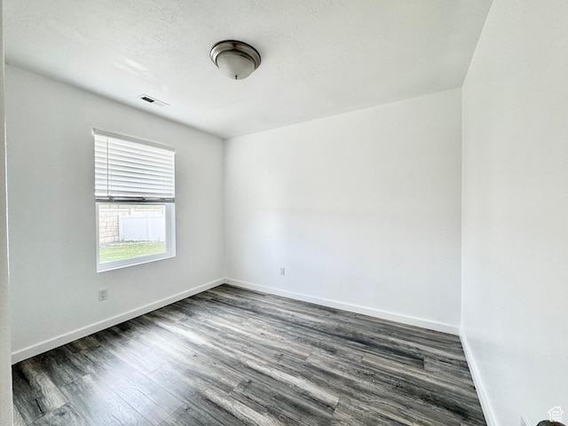 1614 W Eisenhower Way, Salt Lake City, UT 84104 - spare room with dark wood-style floors, visible vents, and baseboards