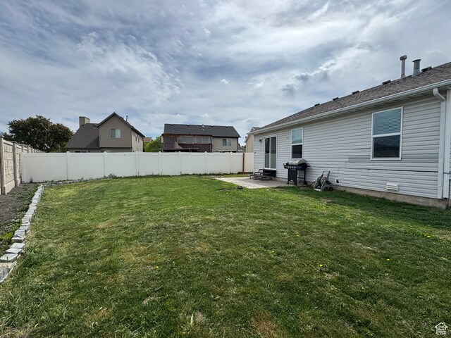 1614 W Eisenhower Way, Salt Lake City, UT 84104 - view of yard with a fenced backyard and a patio area