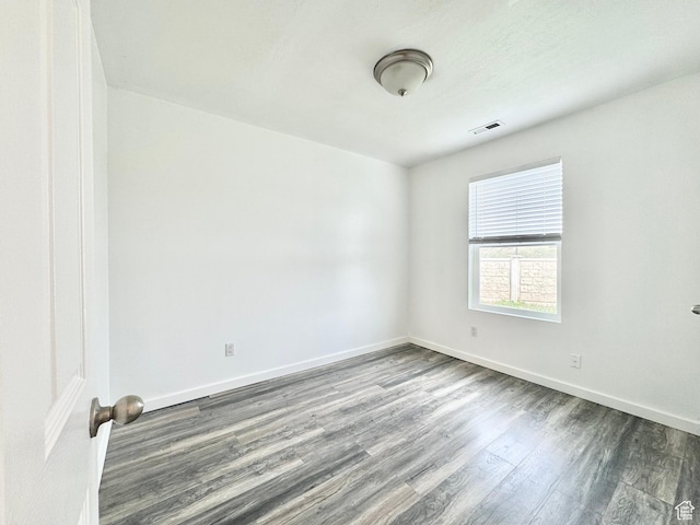 1614 W Eisenhower Way, Salt Lake City, UT 84104 - unfurnished room featuring visible vents, wood finished floors, and baseboards