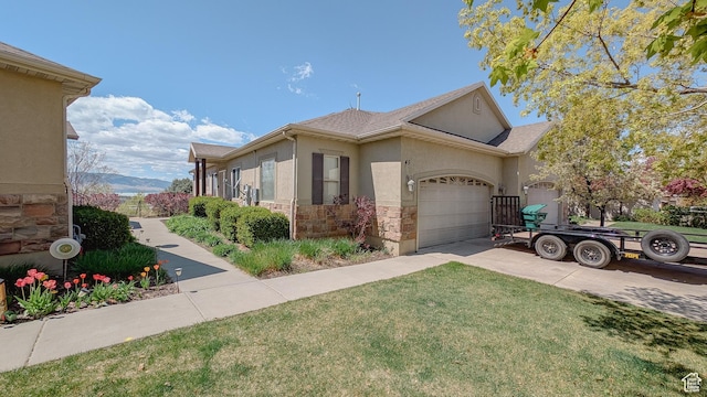view of property exterior with stucco siding, a yard, driveway, stone siding, and an attached garage