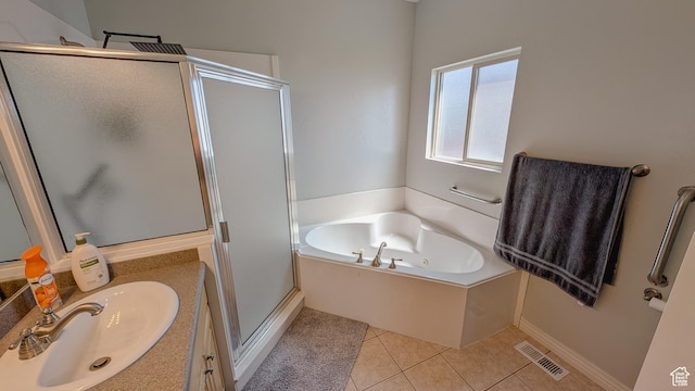 full bath with a shower stall, visible vents, tile patterned floors, a garden tub, and vanity