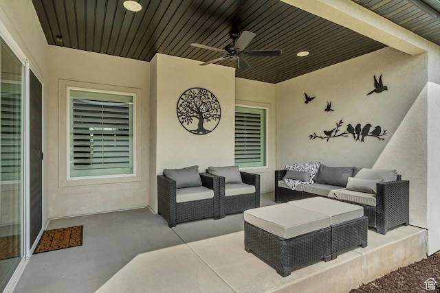 view of patio with an outdoor living space and ceiling fan