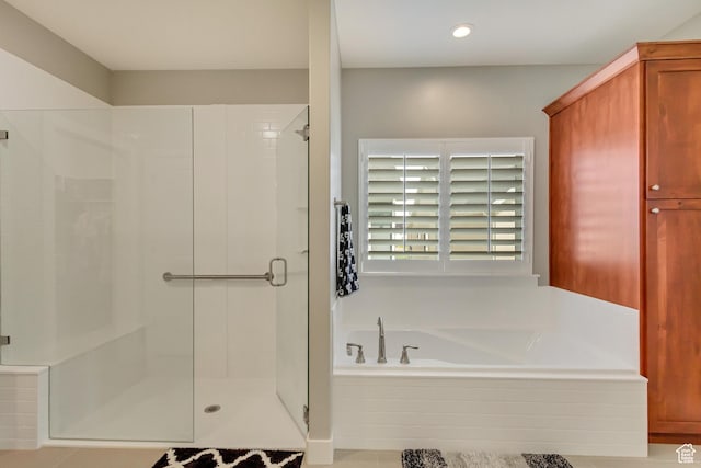 bathroom with a garden tub, recessed lighting, and a shower stall