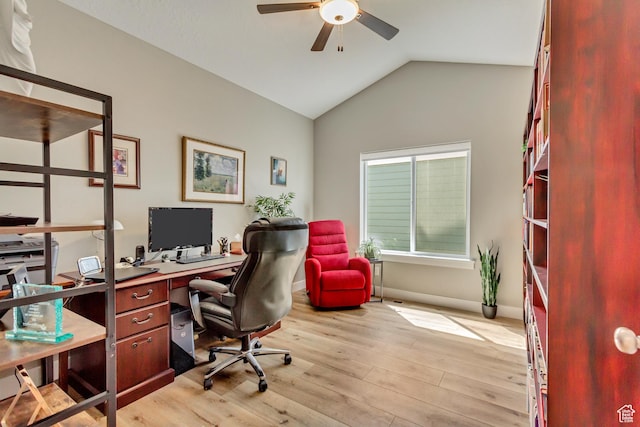 office with ceiling fan, light wood-style flooring, lofted ceiling, and baseboards