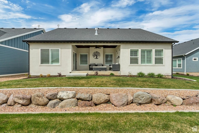back of property featuring roof with shingles, outdoor lounge area, a patio area, a ceiling fan, and a lawn