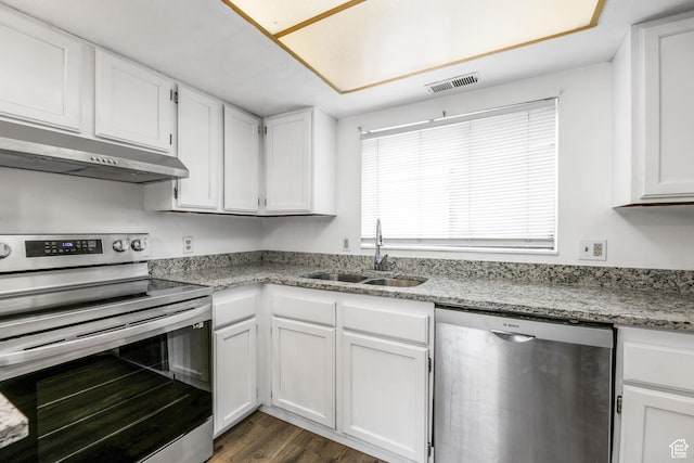 kitchen featuring appliances with stainless steel finishes, a sink, white cabinets, and under cabinet range hood