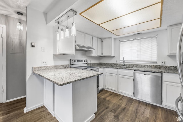 kitchen featuring stainless steel appliances, a sink, under cabinet range hood, a peninsula, and white cabinets