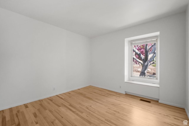 813 N Northview Dr E, Salt Lake City, UT 84103 - empty room with baseboards, visible vents, and light wood-style floors