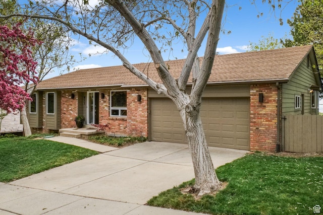 813 N Northview Dr E, Salt Lake City, UT 84103 - ranch-style home featuring a front yard, driveway, brick siding, an attached garage, and fence