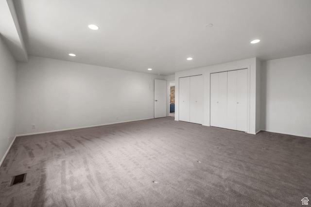 813 N Northview Dr E, Salt Lake City, UT 84103 - unfurnished bedroom with carpet, recessed lighting, visible vents, and two closets