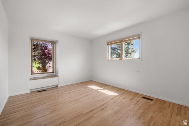 813 N Northview Dr E, Salt Lake City, UT 84103 - empty room with baseboards, visible vents, and light wood-style floors