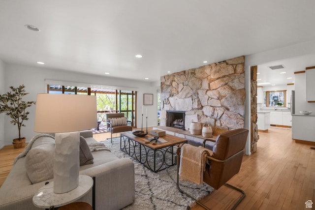 813 N Northview Dr E, Salt Lake City, UT 84103 - living area with recessed lighting, a fireplace, light wood-style floors, visible vents, and baseboards