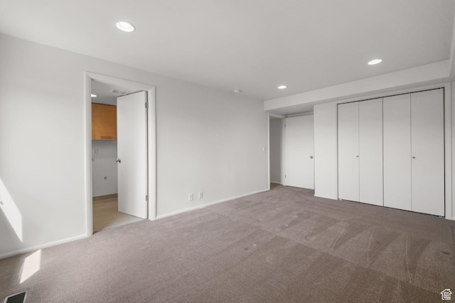 813 N Northview Dr E, Salt Lake City, UT 84103 - unfurnished bedroom with recessed lighting, a closet, visible vents, and light carpet