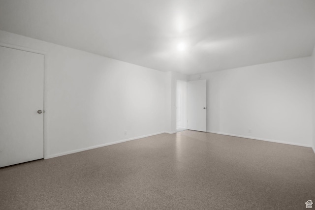 813 N Northview Dr E, Salt Lake City, UT 84103 - empty room with speckled floor and baseboards