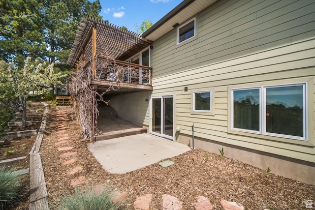 813 N Northview Dr E, Salt Lake City, UT 84103 - back of property featuring a deck and a patio area