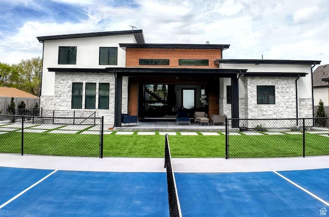 13327 S Bullitt Ln, Draper, UT 84020 - back of house featuring a lawn, stone siding, and fence