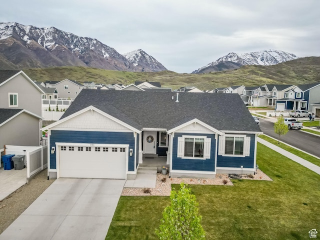 1131 S Red Cliff Dr, Santaquin, UT 84655 - ranch-style house featuring a residential view, a front lawn, a garage, a mountain view, and driveway